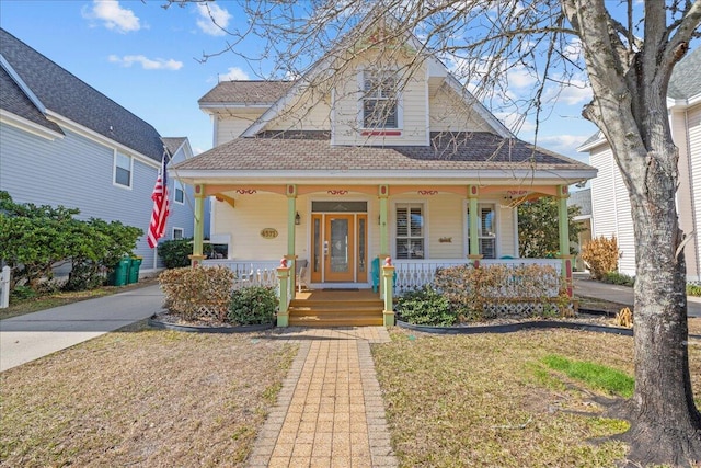 bungalow-style home featuring a front yard and a porch