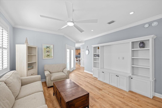 living room featuring crown molding, ceiling fan, and light hardwood / wood-style floors