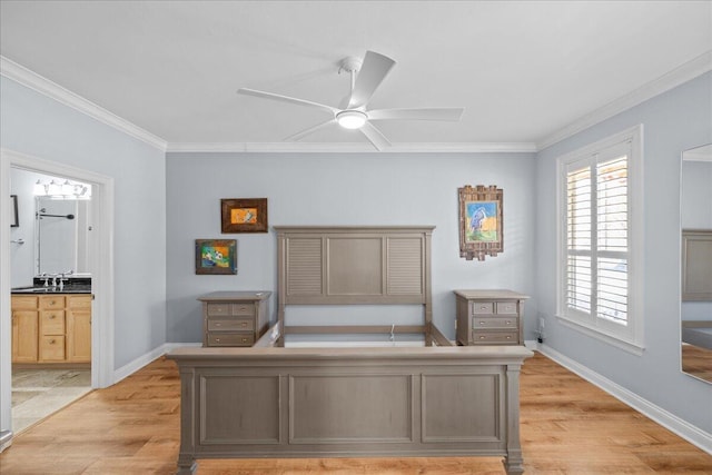 bedroom with crown molding, sink, and light hardwood / wood-style floors