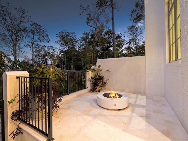 view of patio / terrace with an outdoor fire pit