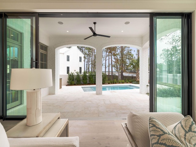 view of patio / terrace featuring a fenced in pool and ceiling fan