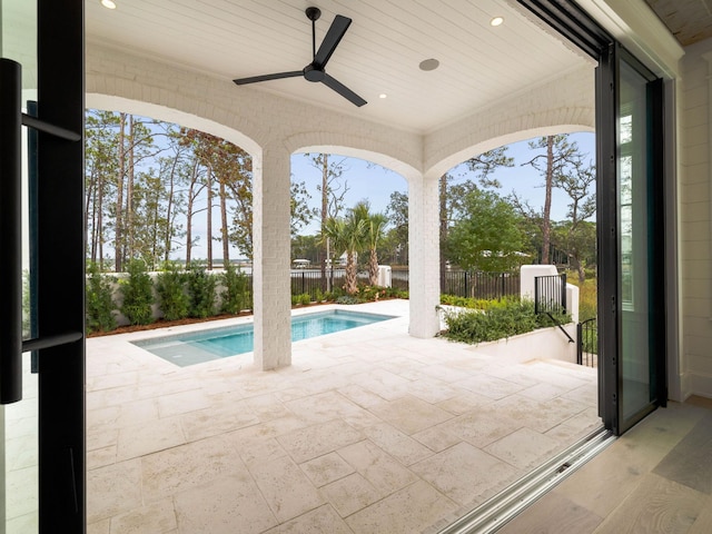 view of pool featuring a patio and ceiling fan