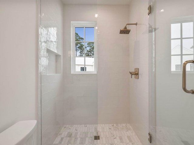 bathroom featuring an enclosed shower