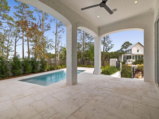 view of pool featuring ceiling fan and a patio area