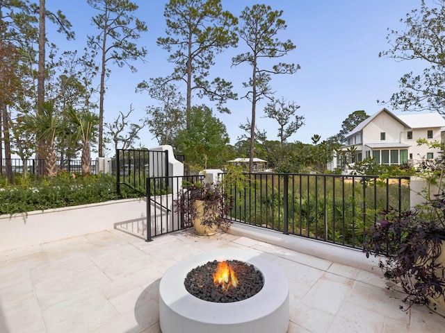 view of patio / terrace with a fire pit