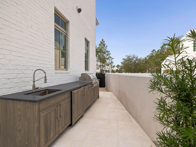 view of patio featuring sink, grilling area, and an outdoor kitchen