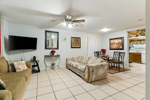 tiled living room featuring ceiling fan