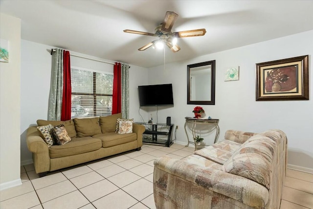 living room with ceiling fan and light tile patterned flooring