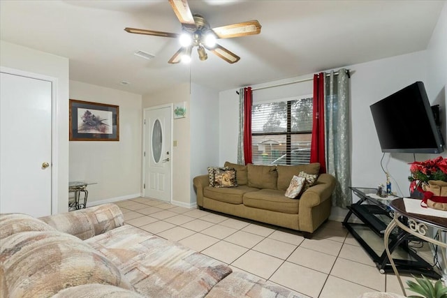 living room featuring light tile patterned floors and ceiling fan