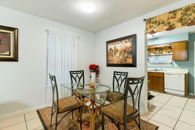 dining room with sink and light tile patterned floors