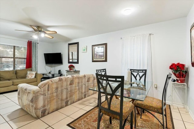 tiled living room with ceiling fan