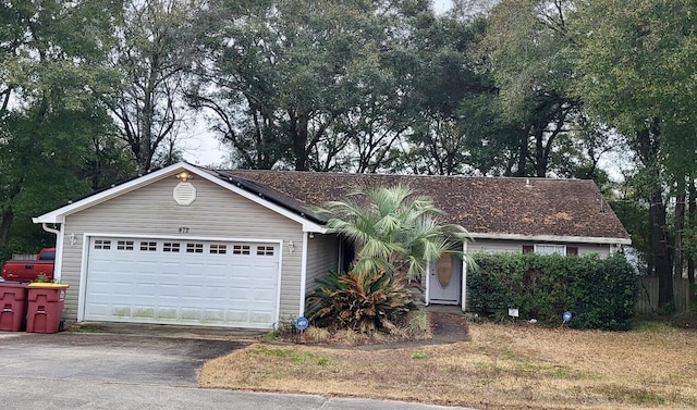 ranch-style home featuring a garage