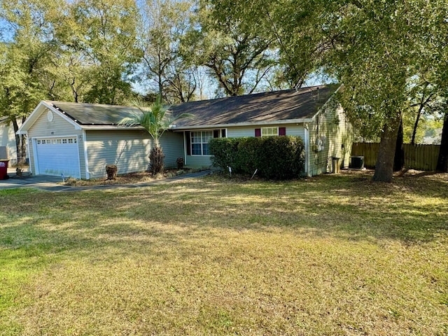 ranch-style house with central AC unit, an attached garage, a front lawn, and fence