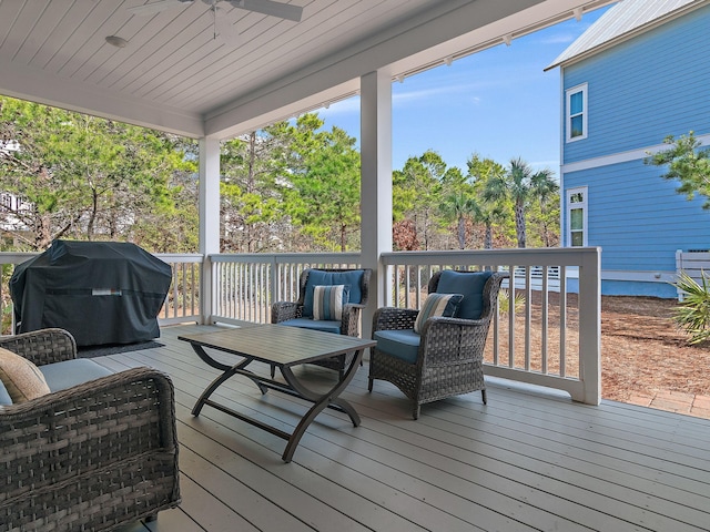 wooden terrace featuring ceiling fan and area for grilling