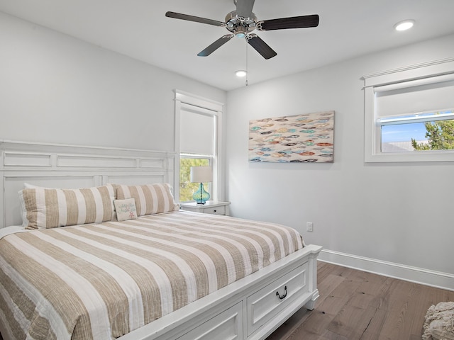 bedroom featuring dark wood-type flooring and ceiling fan