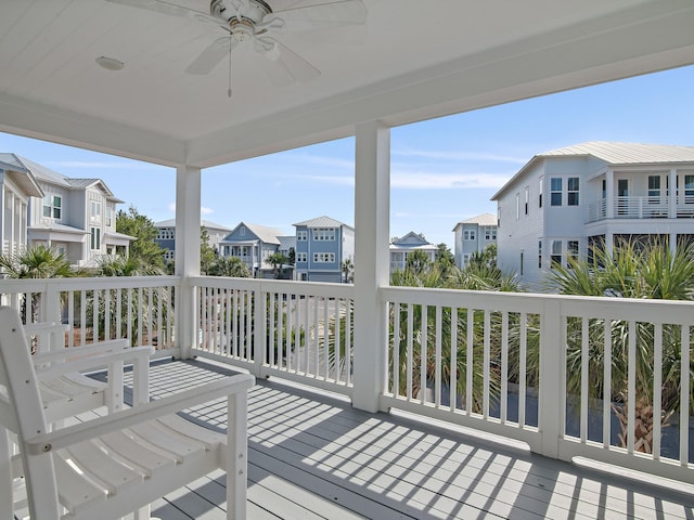 wooden terrace featuring ceiling fan