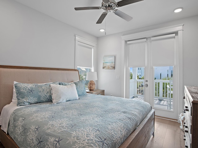 bedroom featuring access to outside, light hardwood / wood-style floors, and ceiling fan