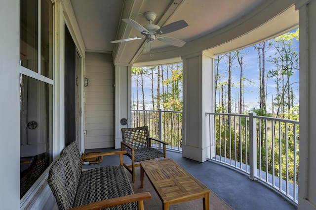 sunroom / solarium with ceiling fan