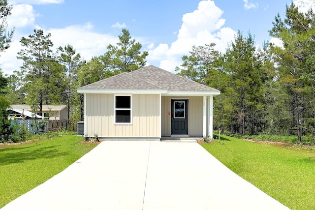view of outdoor structure with fence and central AC unit