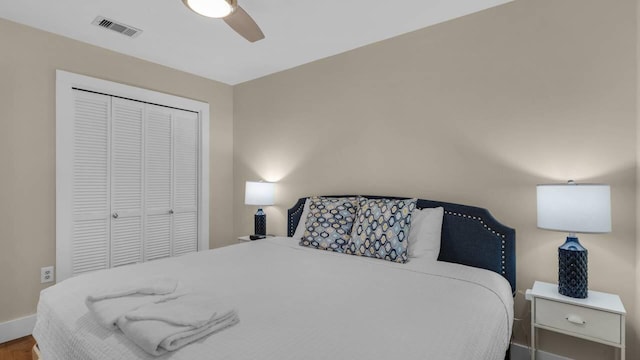 bedroom with ceiling fan and a closet