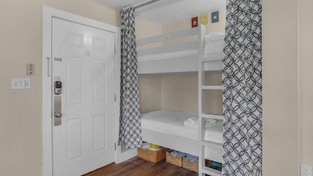 bedroom featuring dark hardwood / wood-style flooring