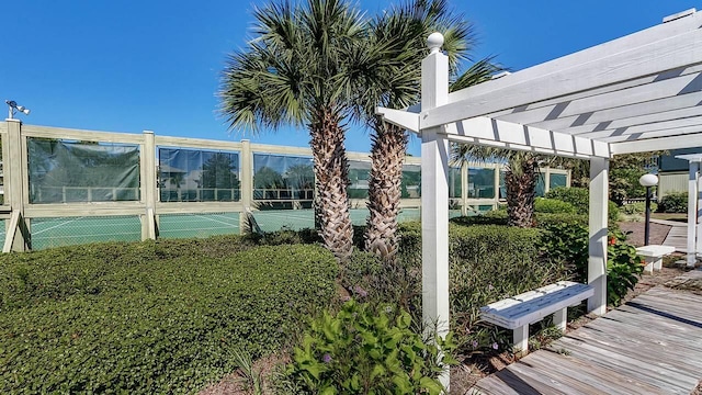 view of yard featuring a pergola and tennis court