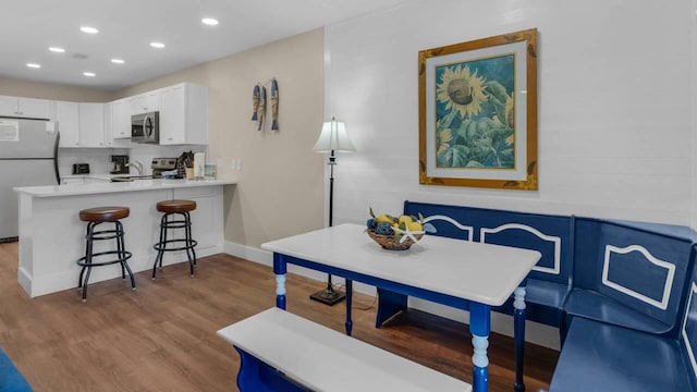 dining space featuring light wood-type flooring