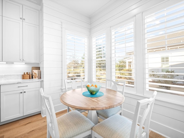 dining space featuring light wood-type flooring