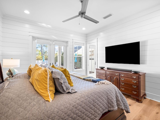 bedroom featuring light hardwood / wood-style flooring, access to outside, and ceiling fan