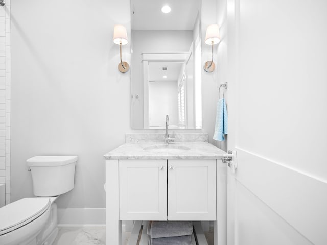 bathroom with vanity and toilet