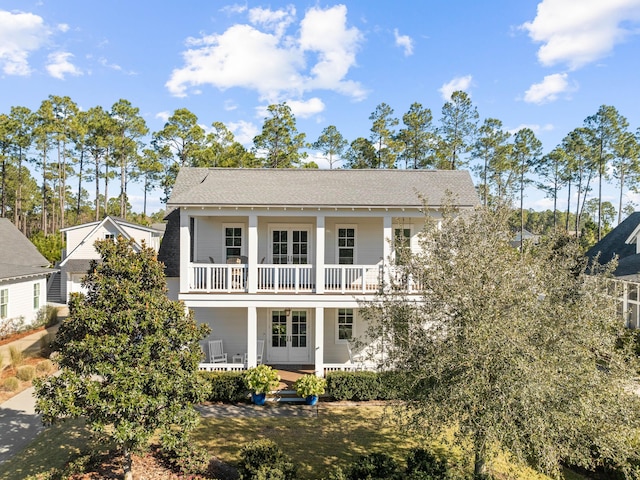 rear view of house featuring a balcony