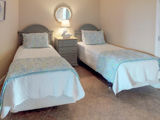 bedroom with tile patterned floors