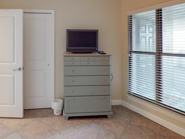 unfurnished bedroom featuring light tile patterned floors