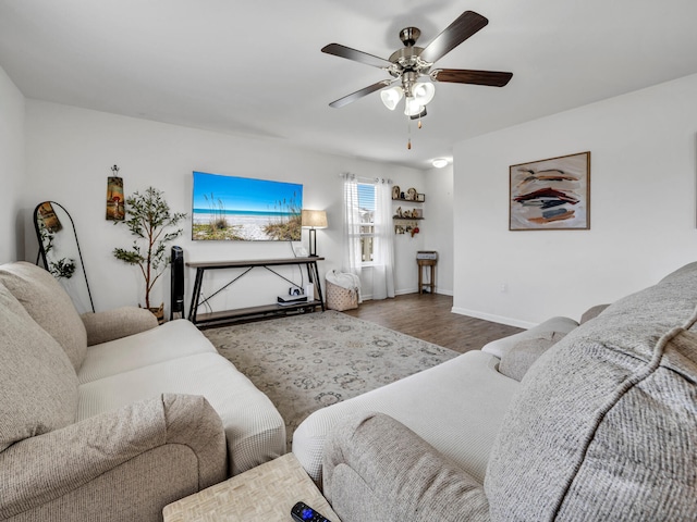 living room with ceiling fan and hardwood / wood-style floors