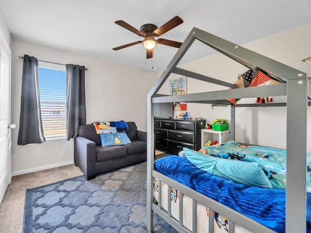 bedroom with ceiling fan and light colored carpet