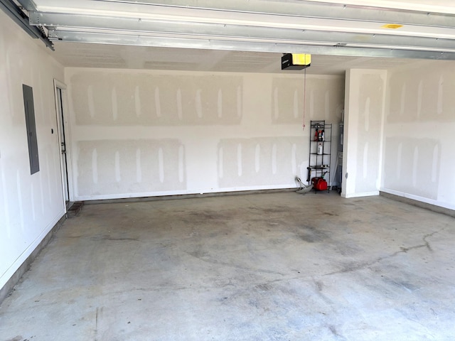 728 Widgeon Way, Crestview, FL 32539 - garage with a garage door opener and electric panel