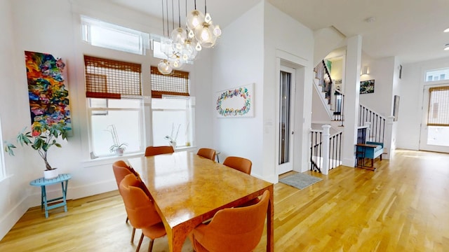 dining room with an inviting chandelier and hardwood / wood-style floors