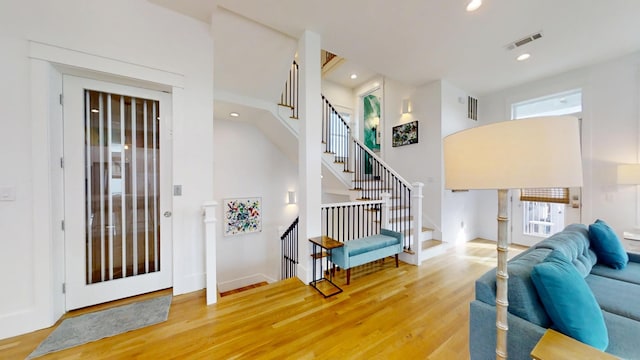 foyer entrance with hardwood / wood-style floors