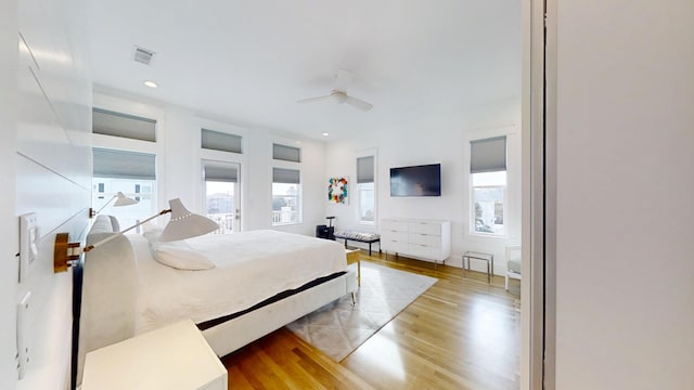 bedroom featuring light hardwood / wood-style flooring and ceiling fan