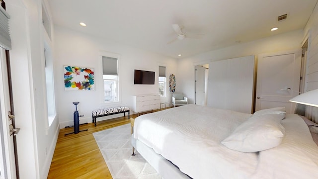 bedroom featuring ceiling fan and light hardwood / wood-style flooring