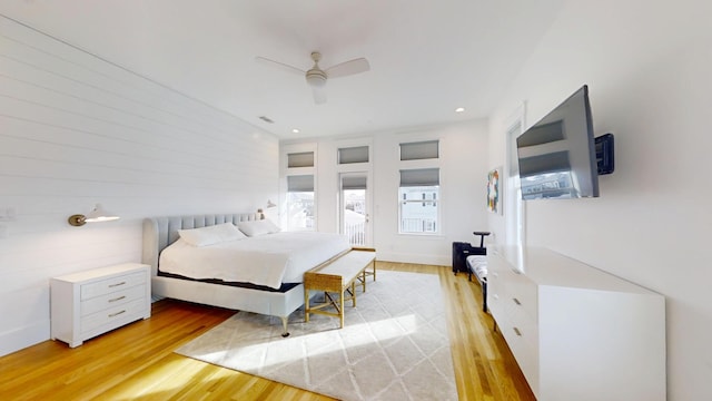 bedroom featuring ceiling fan and light hardwood / wood-style flooring