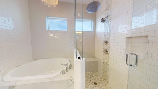 bathroom with separate shower and tub