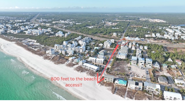 aerial view featuring a beach view and a water view