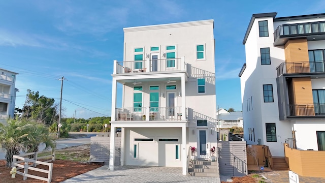 view of front of house with a garage and a balcony