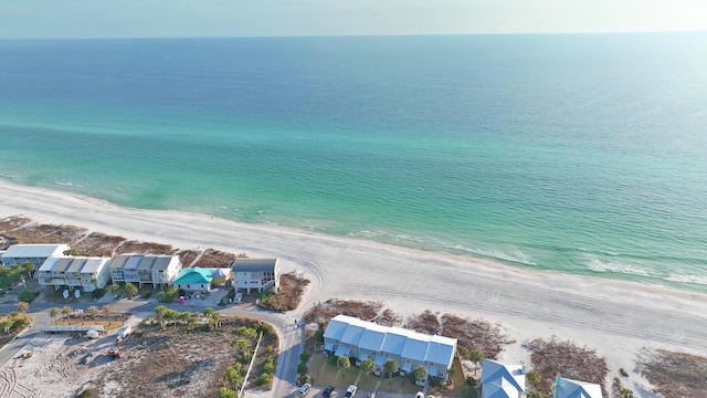 aerial view with a water view and a view of the beach