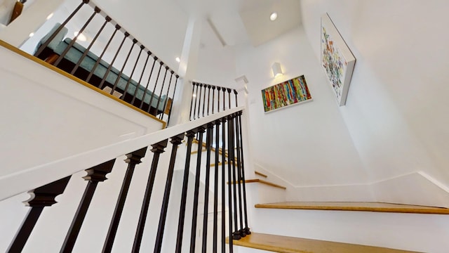 stairway with a towering ceiling