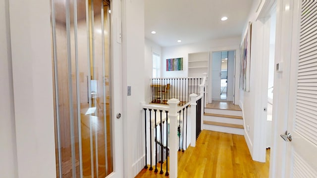 corridor featuring hardwood / wood-style floors