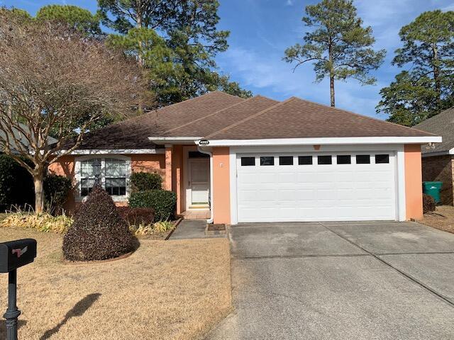 ranch-style home with a garage