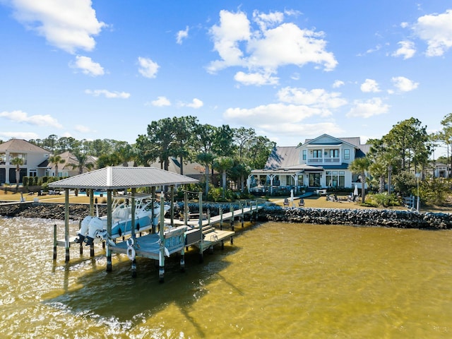 dock area featuring a water view and boat lift