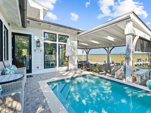 pool featuring a patio area and outdoor lounge area